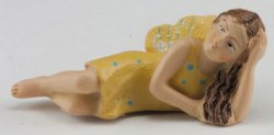 Fairy laying in a yellow dress